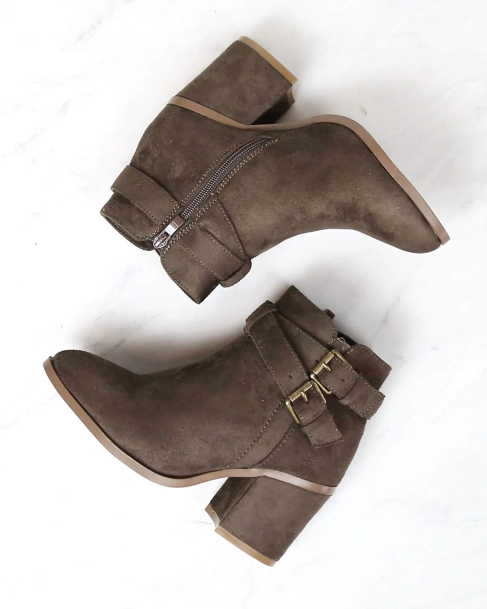 A Grand Entrance Faux Suede Ankle Bootie With Buckle Detail in More Colors