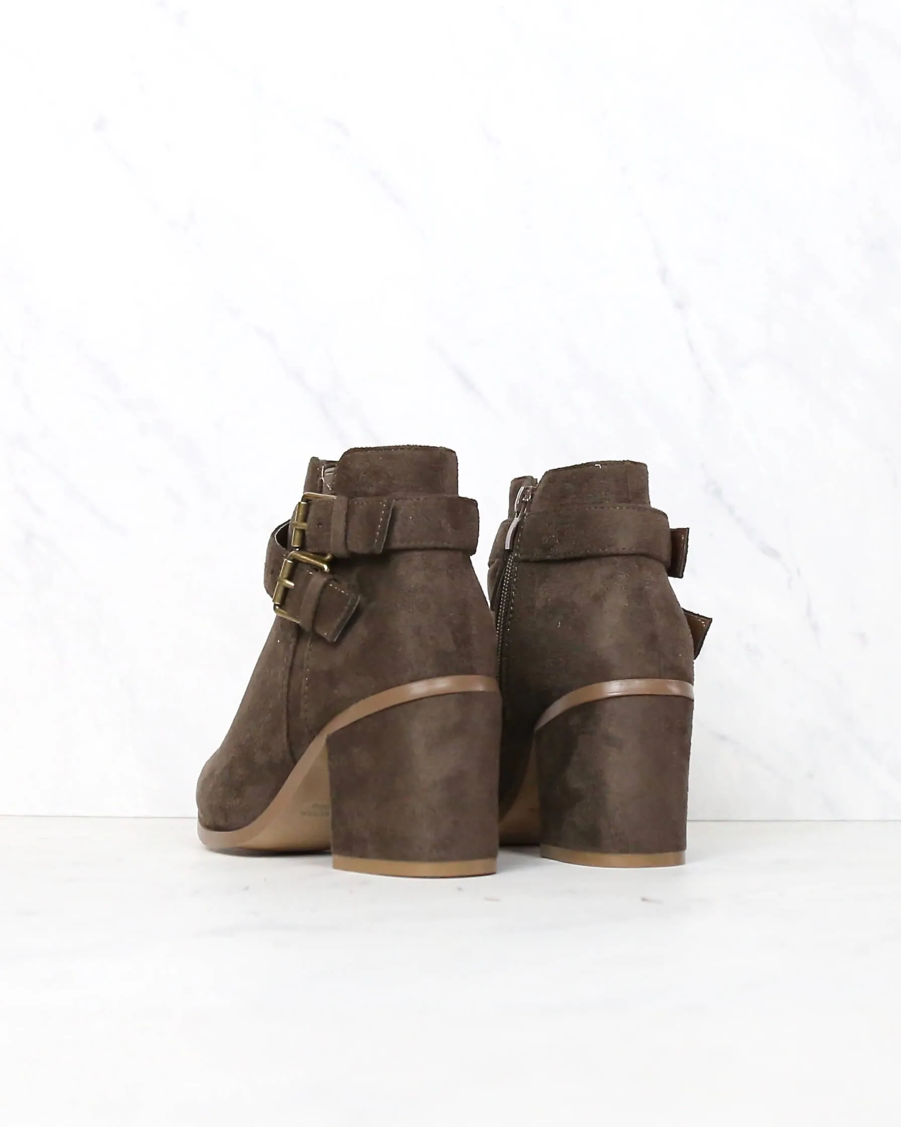 A Grand Entrance Faux Suede Ankle Bootie With Buckle Detail in More Colors